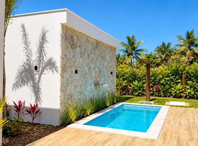 Private pool and deck beside the stone wall