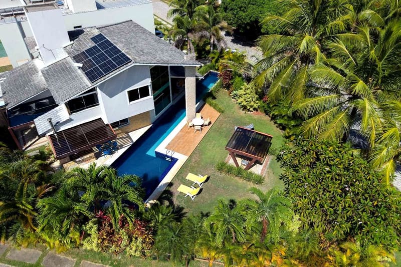 Aerial view of the solar roof, pool and native trees