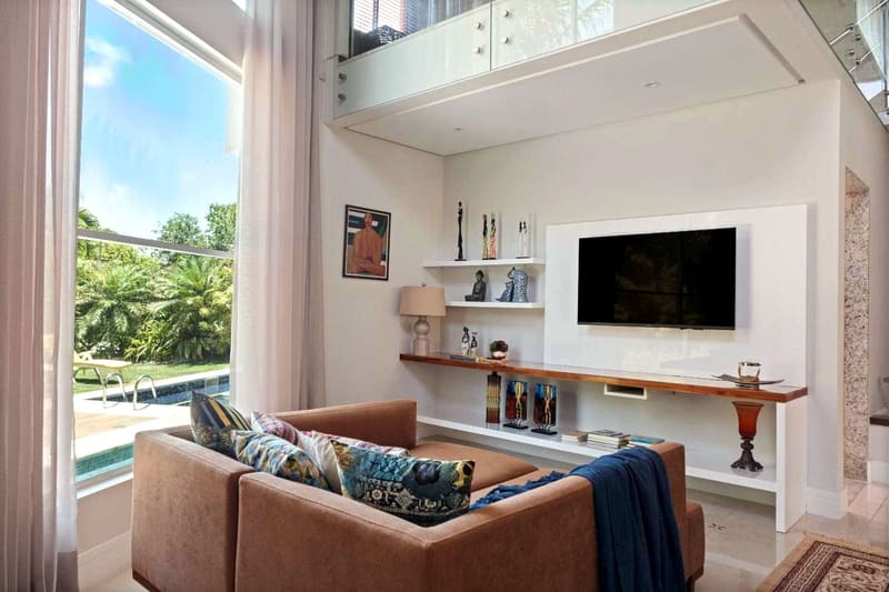 TV room with a view of the pool