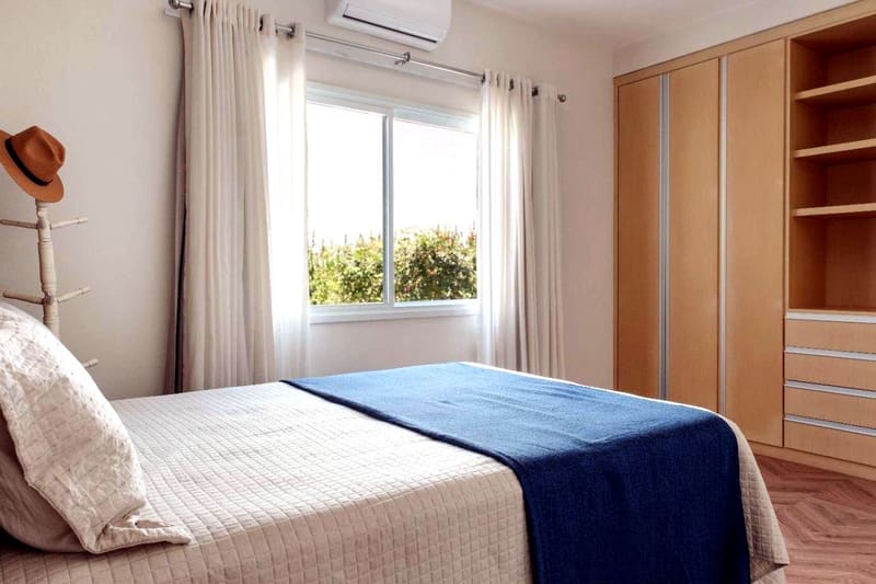 Suite with fitted wardrobes and garden view