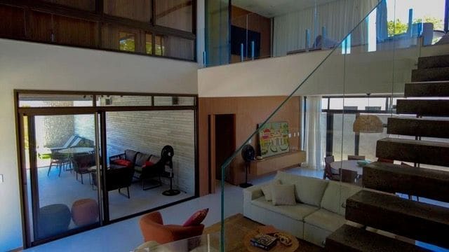 Living room with floating staircase