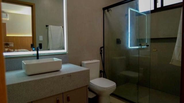 Bathroom with lighted mirror
