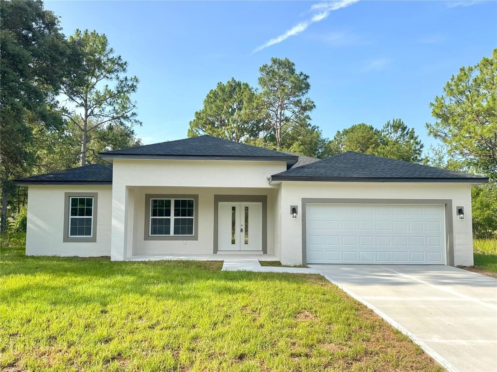 Front of the home with the two-car garage