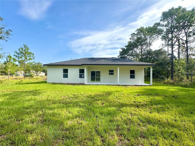 Rear of the home with covered porch