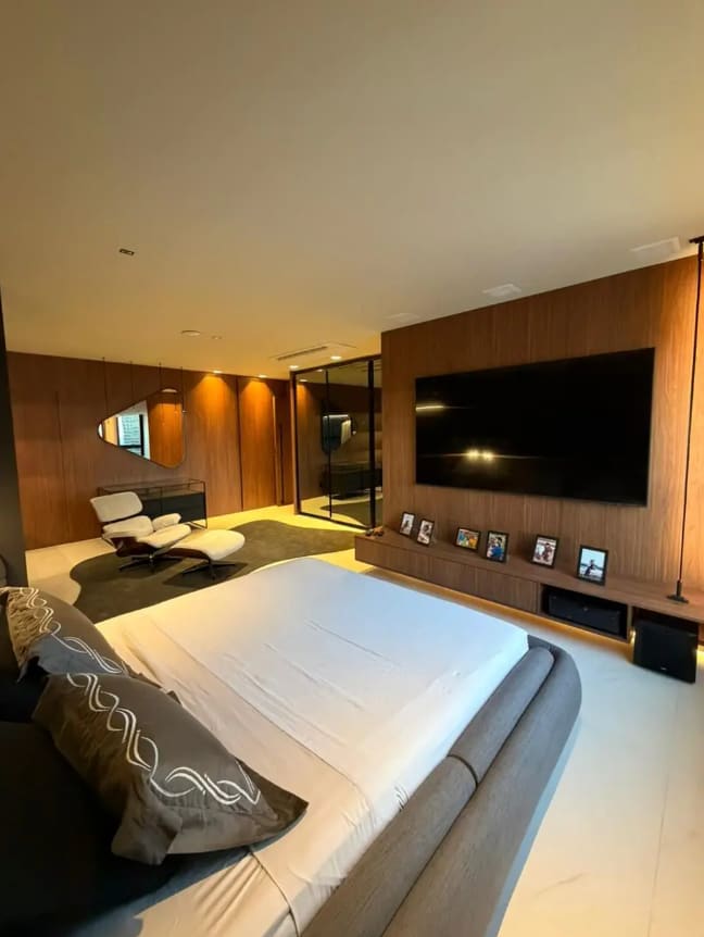 En-suite bedroom with a TV