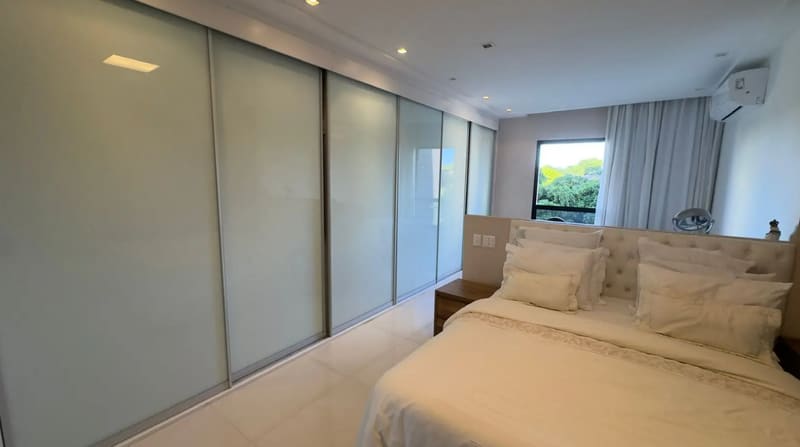 En-suite bedroom with fitted cabinetry