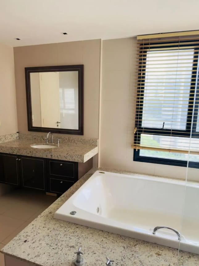 Master en-suite bathroom with a whirlpool tub